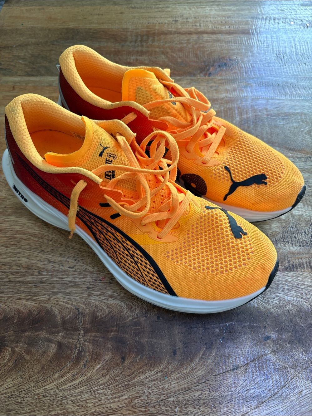 Puma carbon plate Nitro
 Orange Mesh Sneakers with Black Accents